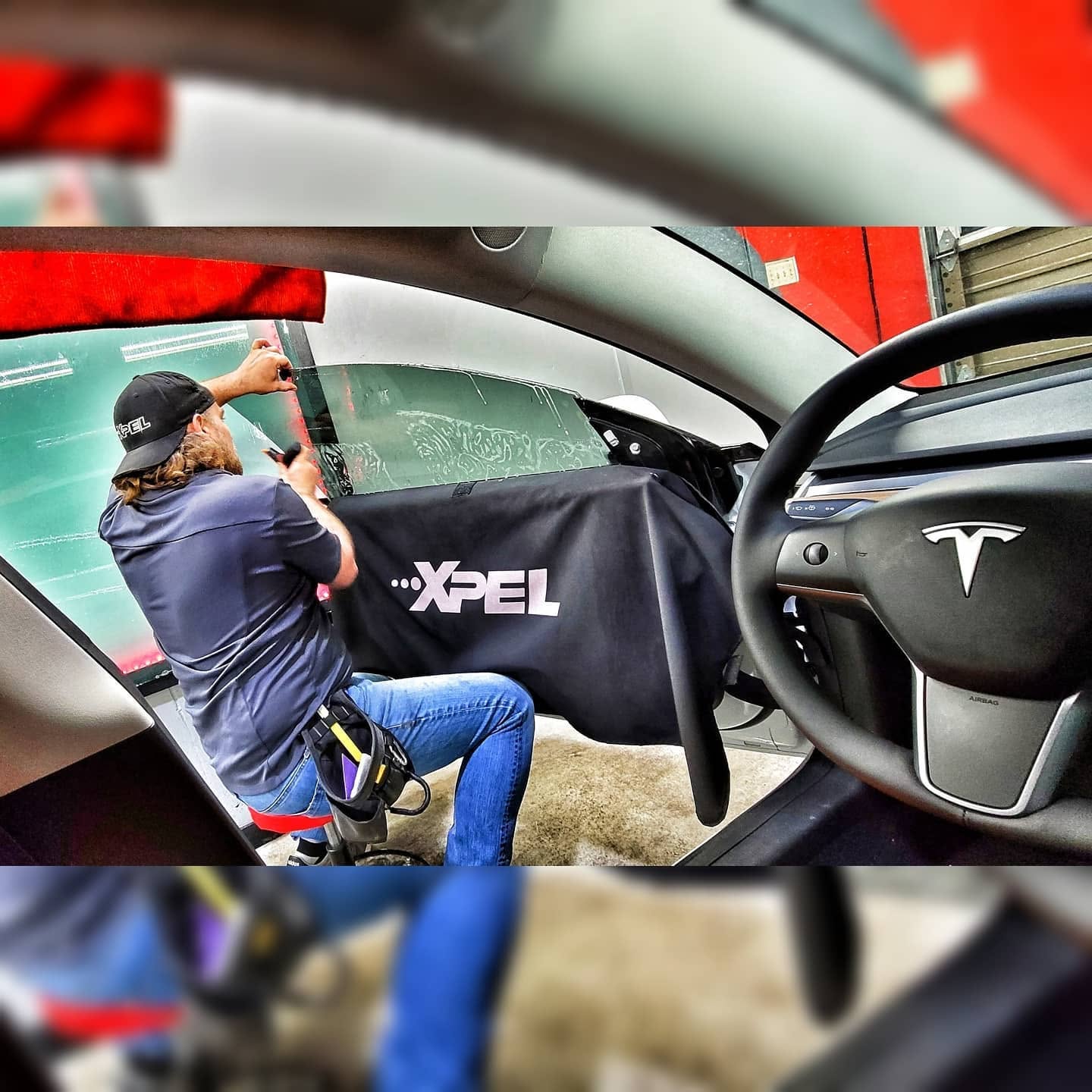 Automotive window tint installation in progress