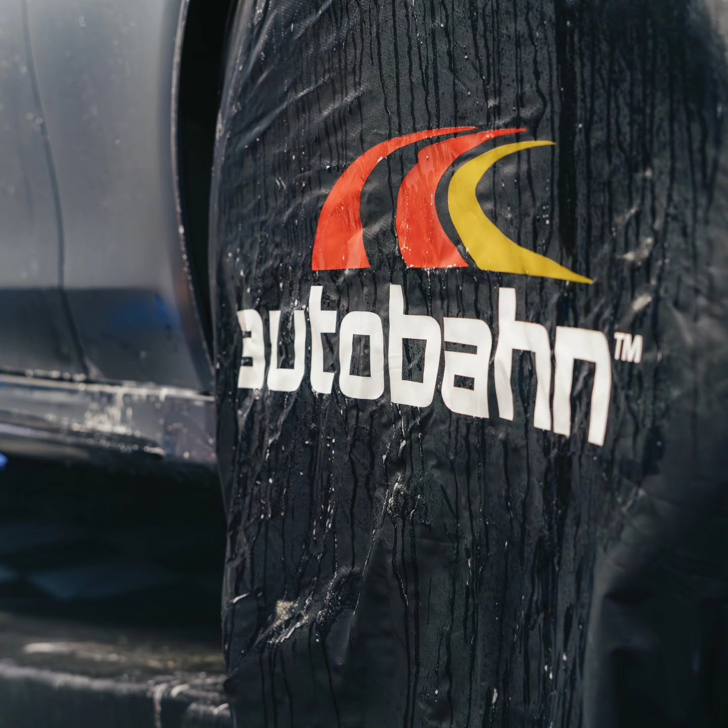 Automotive glass with Autobahn window film