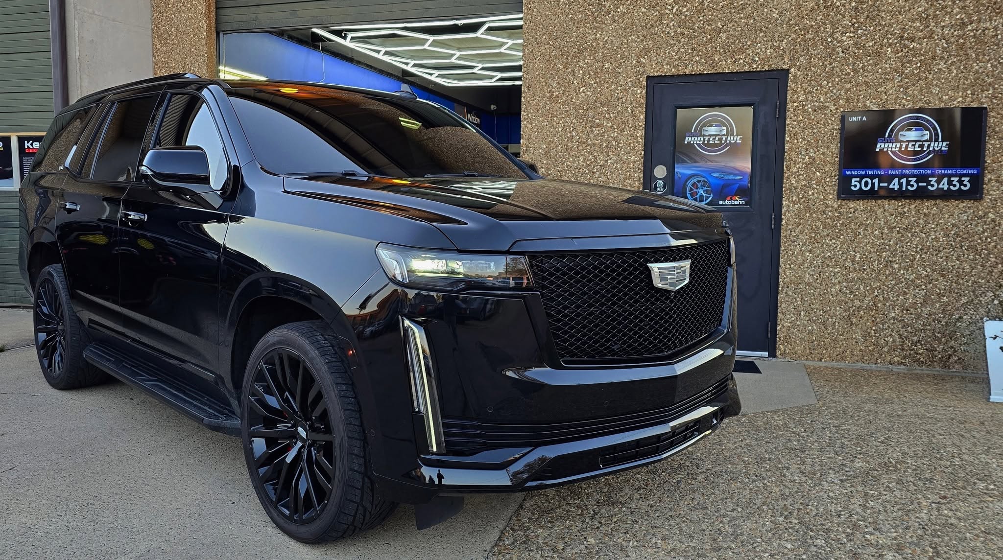 Vehicle being reviewed inside the Elite Protective Film shop